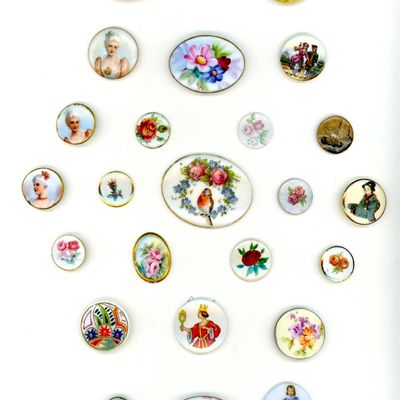 A CARD OF COLORFUL DIVISION ONE CERAMIC BUTTONS