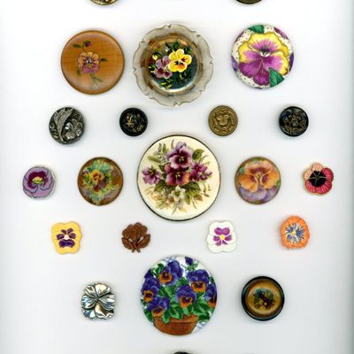 A CARD OF DIVISION ONE AND THREE FLORAL BUTTONS
