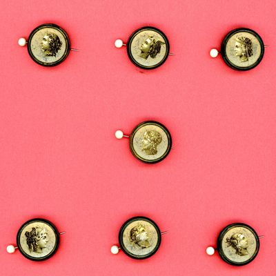 A CARD OF DIVISION ONE HEAD PROFILE BUTTONS