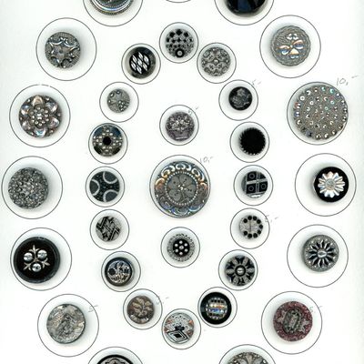 A CARD OF DIVISION ONE BLACK GLASS BUTTONS