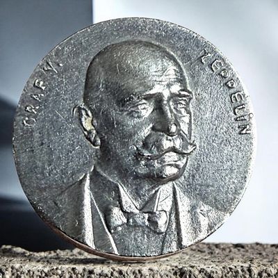 A DIVISION ONE THIRD AVENUE SILVER BUTTON