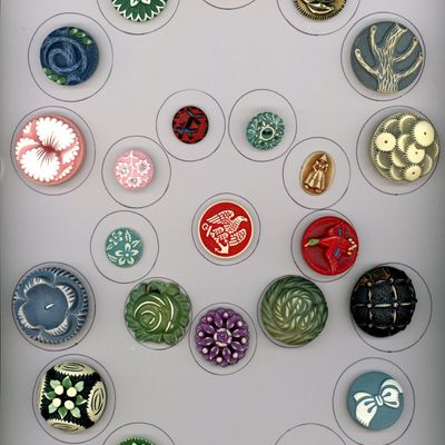 A CARD OF DIVISION THREE CELLULOID BUTTONS