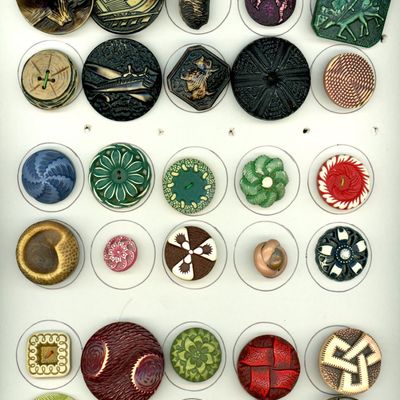A CARD OF DIVISION THREE ASSORTED CELLULOID BUTTONS