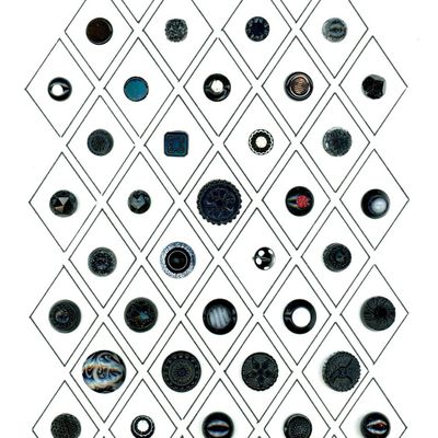 A CARD OF DIVISION ONE ASSORTED BLACK GLASS BUTTONS