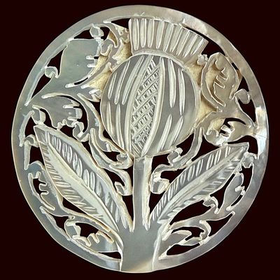 Sale Photo Thumbnail #326: A DIVISION THREE CARVED PEARL PICTORIAL BUTTON