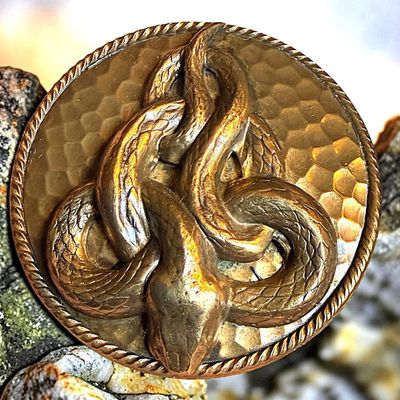 A DIVISION THREE STUDIO ARTIST SNAKE BUTTON