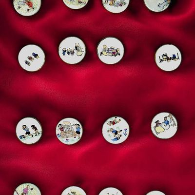 A CARD OF DIVISION THREE STUDIO BUTTONS