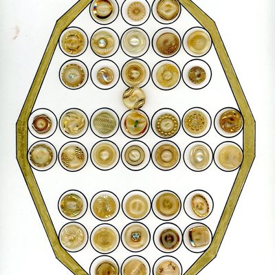 A CARD OF DIVISION THREE MOONGLOW GLASS BUTTONS