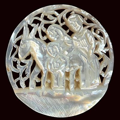 A DIVISION THREE CARVED PEARL PICTORIAL BUTTON