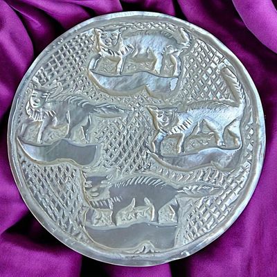 Sale Photo Thumbnail #331: A DIVISION THREE CARVED PEARL ANIMAL BUTTON