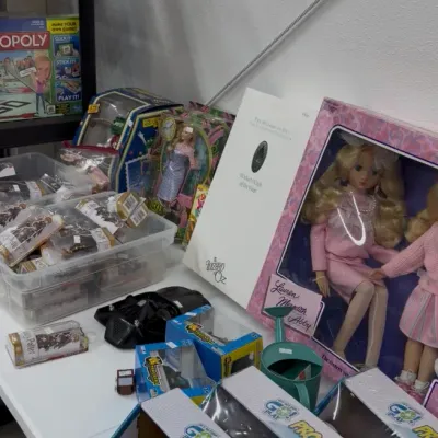 Collection of toys, games, and dolls including Go Play Pro-Ball sets, boxed dolls, and various collectibles.