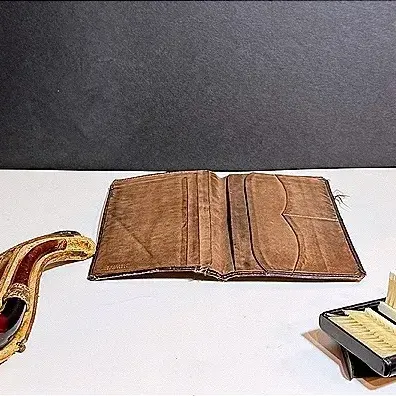 Vintage Men’s Accessories Featuring A Smoking Pipe, Leather Wallet & Travel Lint Brush