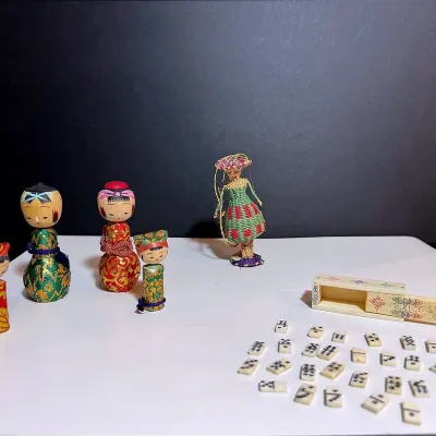 Folk Art Collectibles: Japanese Kokeshi Dolls, Mini Mexican Dominoes & Wicker Ornament