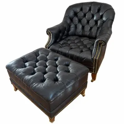 Lot 520   
Black Leather Tufted Club Chair and Ottoman with Brass Nailhead Trim