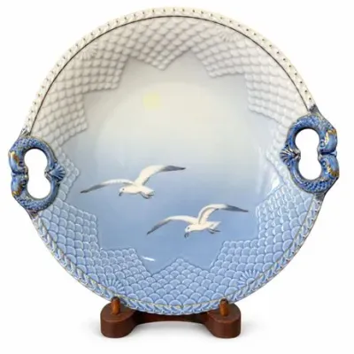 Lot 339   
Bing & Grøndahl “Seagull” Round Cake Plate with Dolphin Handles, No. 101