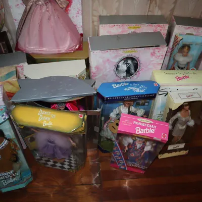 Sale Photo Thumbnail #86: Collection of vintage 1990s collector edition Barbie dolls in their original packaging, including Native American Barbie, Norwegian Barbie, and Hollywood Legends Collection editions.