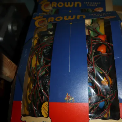 Sale Photo Thumbnail #72: Vintage Crown 15-light Christmas tree light set in its original red and blue display box, featuring colorful General Electric bulbs.