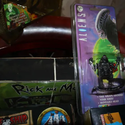 Sale Photo Thumbnail #104: Vintage Hope Aliens collectible action figure sealed on card alongside a Rick and Morty construction set in original box.