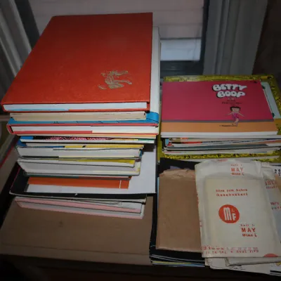 Sale Photo Thumbnail #101: A collection of vintage books, comic reprints, and paper ephemera including a Betty Boop book.