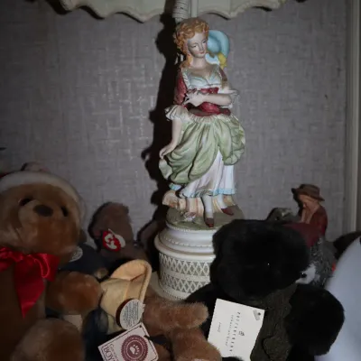 Sale Photo Thumbnail #158: Vintage porcelain figurine table lamp depicting an 18th-century style woman, surrounded by collectible teddy bears including Boyds Bear and Pottery Barn, along with toy vehicles.