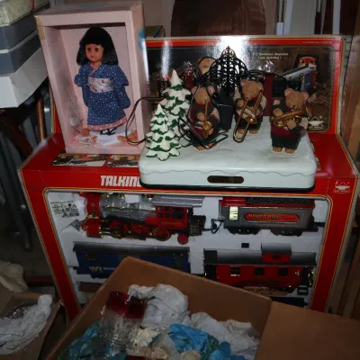 Sale Photo Thumbnail #42: Vintage holiday collectibles, including a boxed Talking Silver Express train set, a musical teddy bear band display, and a boxed Japanese kimono doll.