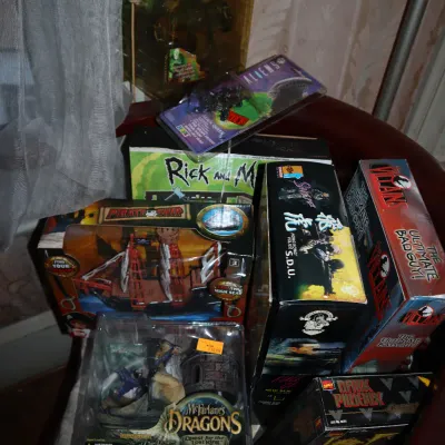 Sale Photo Thumbnail #103: Assortment of boxed collectible toys and action figures, including McFarlane's Dragons, Rick and Morty, and Aliens figures.