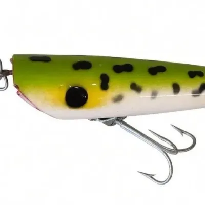 Sale Photo Thumbnail #115: Lot 188: Vintage hard-plastic fishing lure. Green-and-white body with black spots, metal spinner blade attached at the top, two treble hooks, and a small cork piece near the bottom. Shows light wear. Classic mid-century spinner/topwater