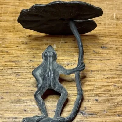 Sale Photo Thumbnail #625: Lot 729: Cast iron hanging frog