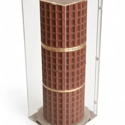 Sale Photo Thumbnail #33: Lot 106: Vintage rotating earring display clear acrylic - enclosure and reddish-brown cylindrical insert featuring a grid of slot - no key / 16 x 16 x 38