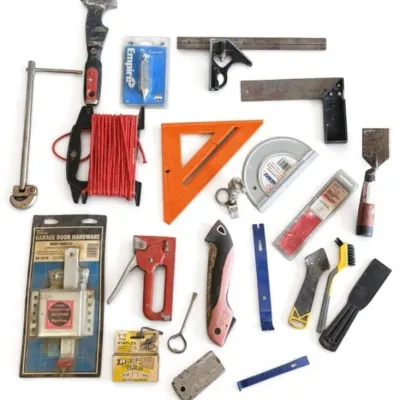 Sale Photo Thumbnail #22: Lot 95: Assorted hand tools and hardware - red staple gun, orange speed square, utility knife, scrapers, brushes, measuring tools, packaged garage door hardware, staples, and various other tools and parts.