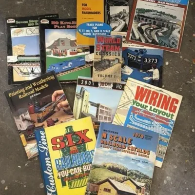 Sale Photo Thumbnail #280: Lot 351: Vintage model toy train track and building books