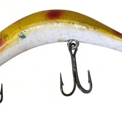 Sale Photo Thumbnail #116: Lot 189: Vintage hard-plastic fishing lure. Curved yellow-and-white body with red accents and paint wear, two treble hooks attached. Classic mid-century style