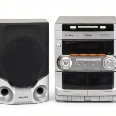 Sale Photo Thumbnail #60: Lot 133: Philips stereo system with matching speakers subwoofer. Silver-and-black mini component unit with CD player, radio, and dual cassette decks, paired with two bookshelf speakers and a gray subwoofer - (tested good -CD Player and stereo working , Ta