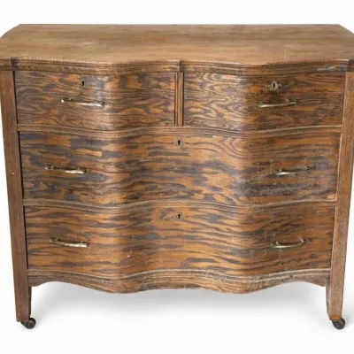 Sale Photo Thumbnail #39: Lot 112: Antique oak chest of drawers with a serpentine front- needs TLC, the wheels do not roll - 41 x 22 x 34
