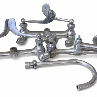 Sale Photo Thumbnail #26: Lot 99: vintage chrome faucet and plumbing parts, including lever handles, cross handles, spouts, and curved pipe sections