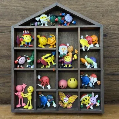 Sale Photo Thumbnail #411: Lot 512: Collectible display box w/ happy face figurines
