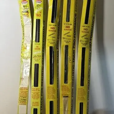 Sale Photo Thumbnail #240: Lot 311: 10 pieces HO & 13 pieces N scale bottle train track