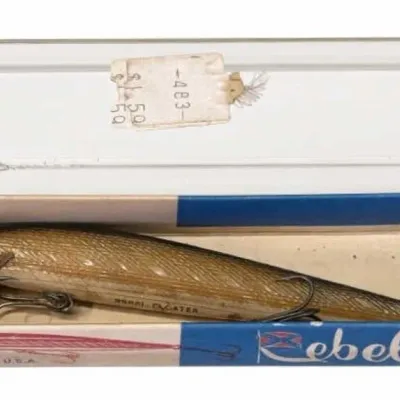 Sale Photo Thumbnail #108: Lot 181: Rebel Floater fishing lure in original blue-and-white cardboard box with clear plastic l