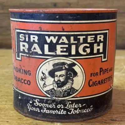 Sale Photo Thumbnail #319: Lot 420: 1950s Sir Walter Raleigh tobacco tin
