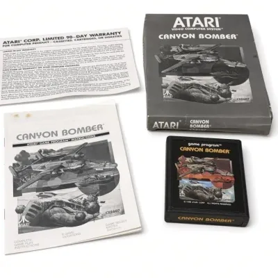 Sale Photo Thumbnail #5: Lot 5a: 1988 Atari 2600 Canyon Bomber game cartridge (CX2607) with original gray box, instruction manual, and warranty card