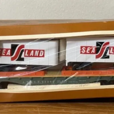 Sale Photo Thumbnail #250: Lot 321: Tyco HO scale Piggyback Flag Train Car Sealand