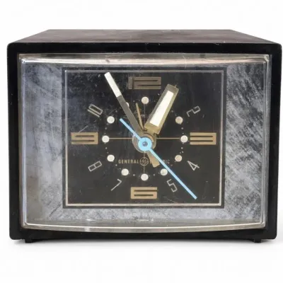 Sale Photo Thumbnail #73: Lot 146: McM General Electric electric clock - cord has a few worn spots recommend replacing
