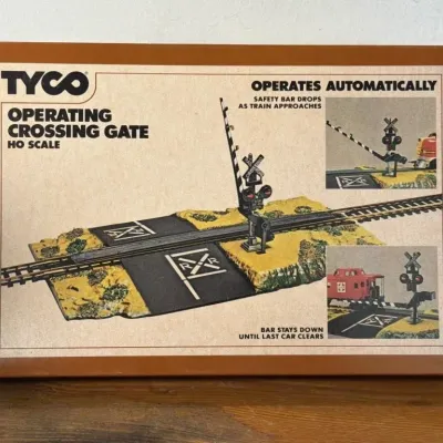 Sale Photo Thumbnail #260: Lot 331: Tyco HO scale Operating crossing gate - box is still taped