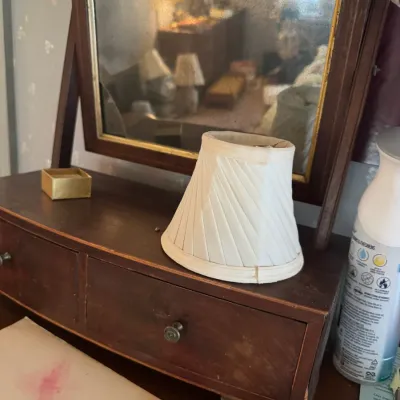 Sale Photo Thumbnail #184: Vintage tabletop vanity mirror with a dark wood frame, small drawers, and gold trim around the mirror glass.