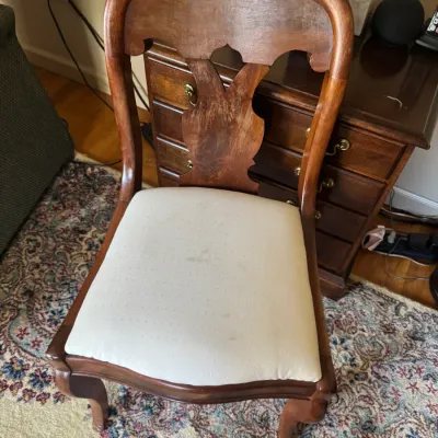 Sale Photo Thumbnail #282: Vintage wood dining chair featuring a shaped splat back, cabriole legs, and an upholstered seat cushion with light surface wear.