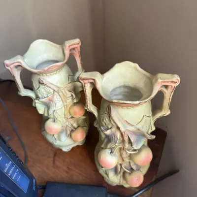 Sale Photo Thumbnail #37: Pair of vintage ceramic Art Nouveau style double-handled vases decorated with sculpted fruit and vine motifs.