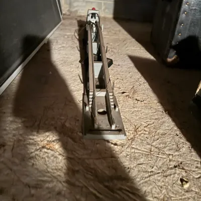Sale Photo Thumbnail #80: Vintage Lionel train track accessory base with wiring, showing light wear and dust.