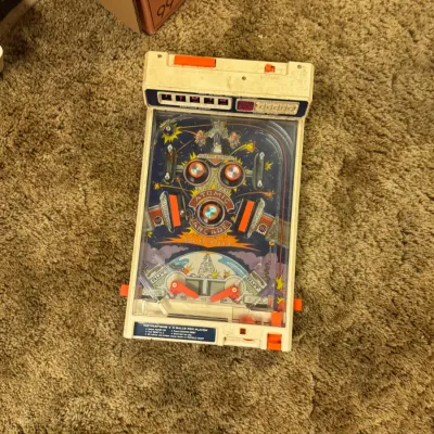 Sale Photo Thumbnail #7: Vintage Tomy Atomic Arcade pinball game, featuring space-themed graphics and mechanical flippers.