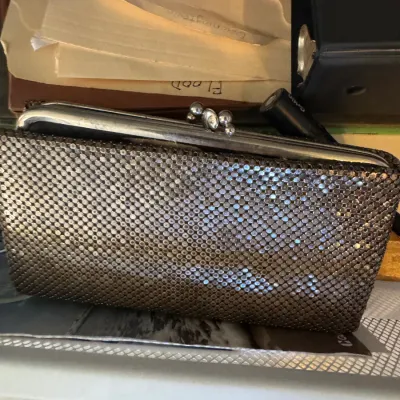 Sale Photo Thumbnail #30: Vintage gunmetal mesh clutch purse with a kiss-lock closure frame.