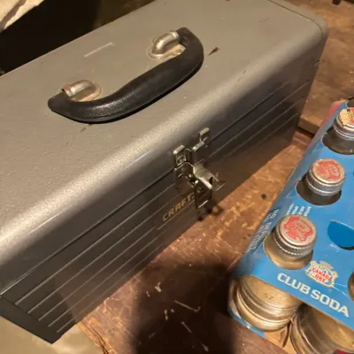 Sale Photo Thumbnail #72: Vintage grey Craftsman steel toolbox with top carrying handle, shown alongside a six-pack of Canada Dry Club Soda.